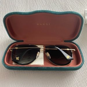 Gucci gold and black sunglasses